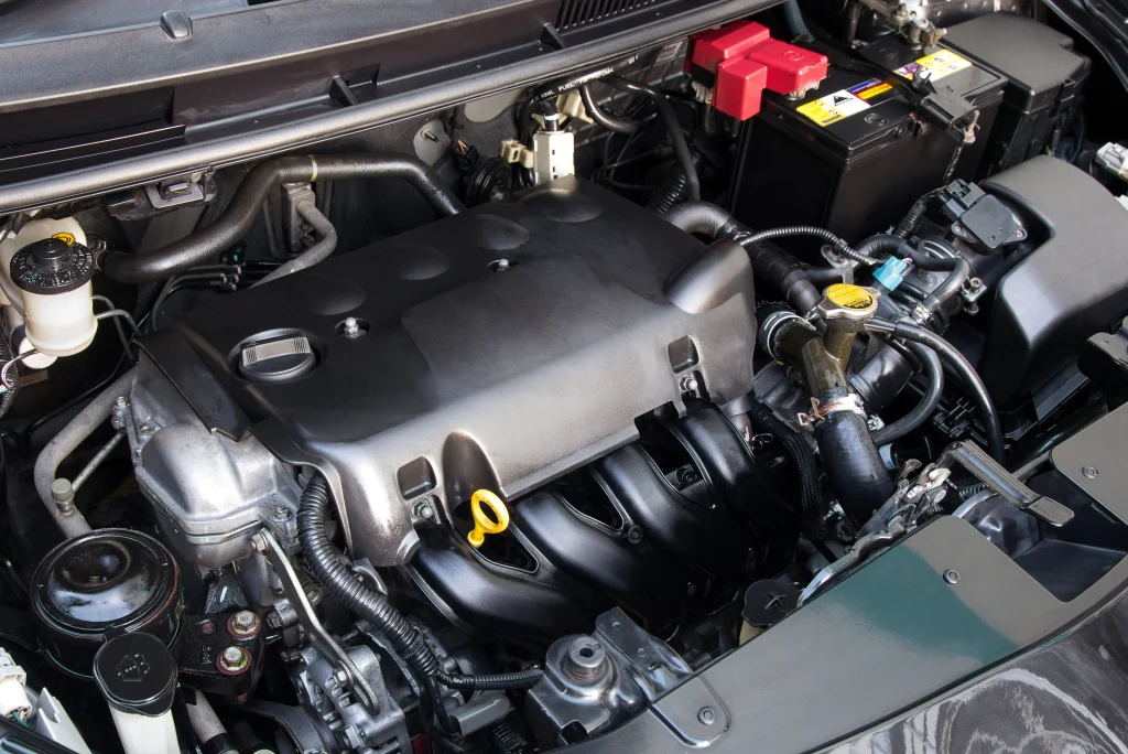 Alternator And Starter Repair Showing A Car With The Hood Open And The Engine Exposed For Detailed Inspection