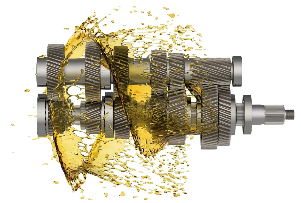Helical gears with golden oil splash representing the essential process of a professional transmission fluid change.